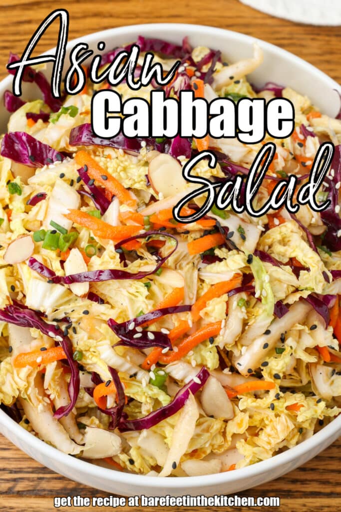 multi color Asian cabbage salad in a white bowl on a wooden surface with a blue and white linen and a text overlay to describe the photo