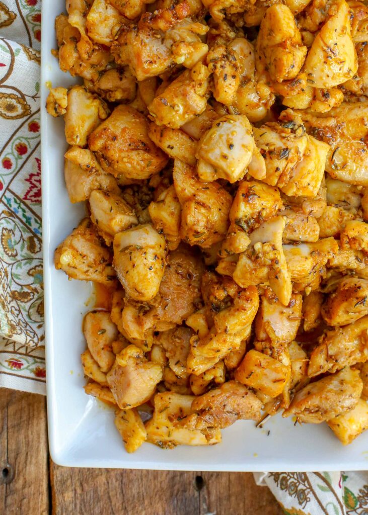 close up of indian chicken on white platter