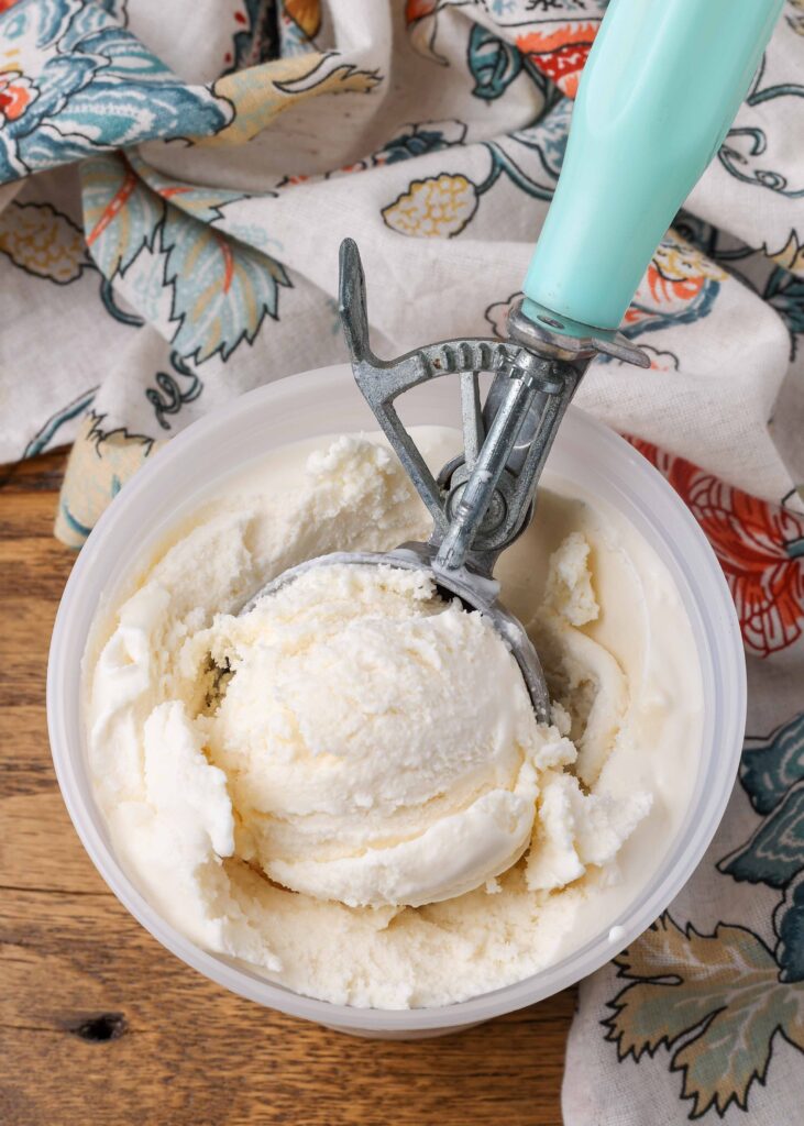 overhead photo of ice cream container with light blue scoop