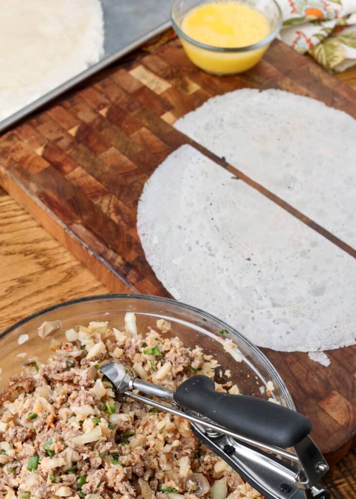 ingredients for lumpia rolls on cutting board