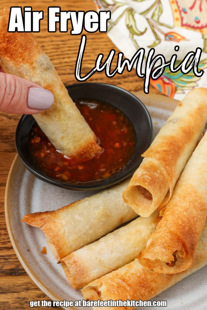 close up of lumpia on plate with dipping sauce