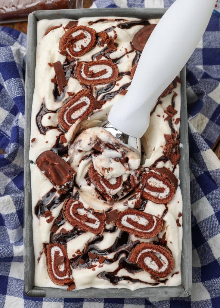 close up scoop of ice cream with swiss rolls 