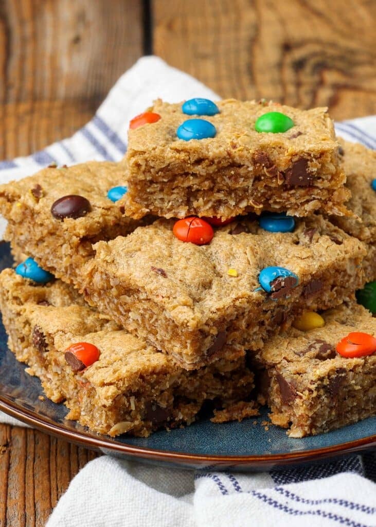 close up of cookie bars topped with m&ms