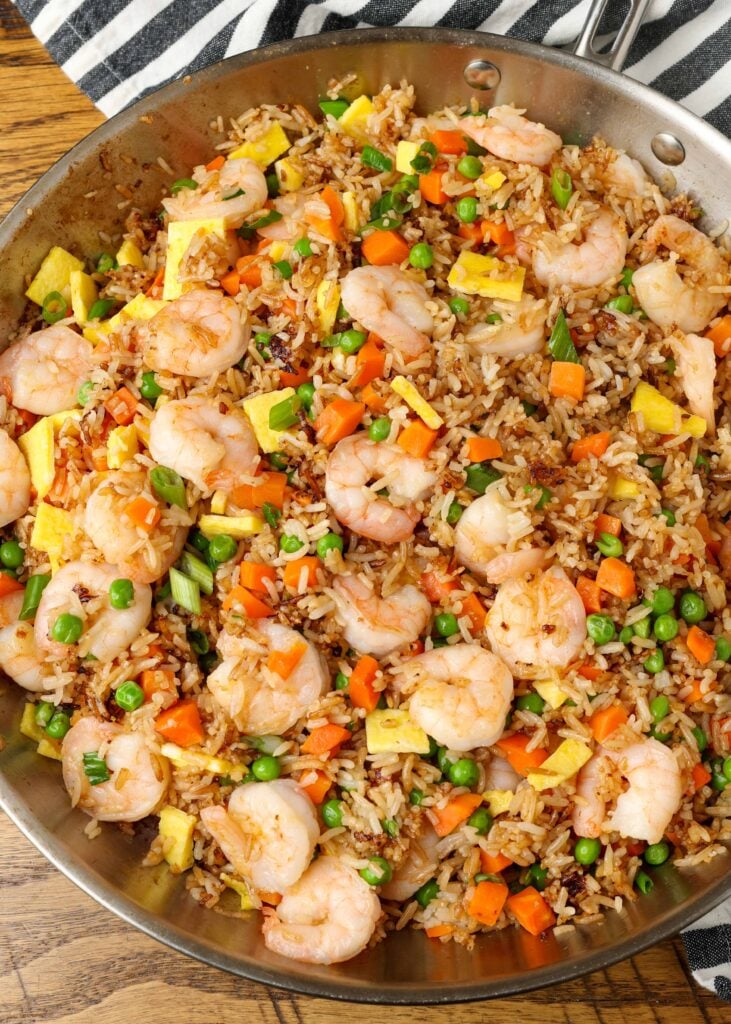 skillet of fried rice on table