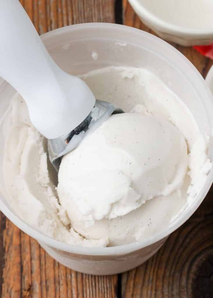 close up of vanilla bean coconut ice cream with scoop