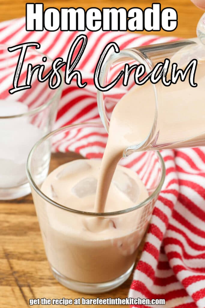 pouring homemade irish cream into a shot glass by a red and white striped linen with text overlay describing the photo