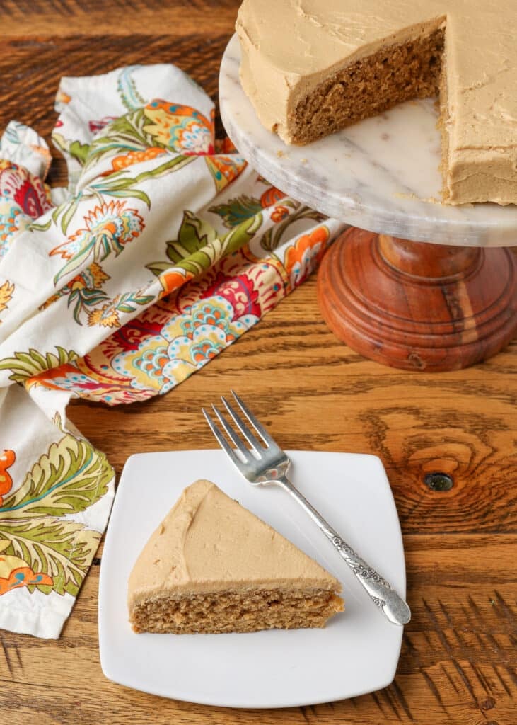 coffee cake with coffee frosting on a plate with a fork