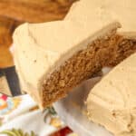 coffee cake with coffee frosting on a plate with a spatula