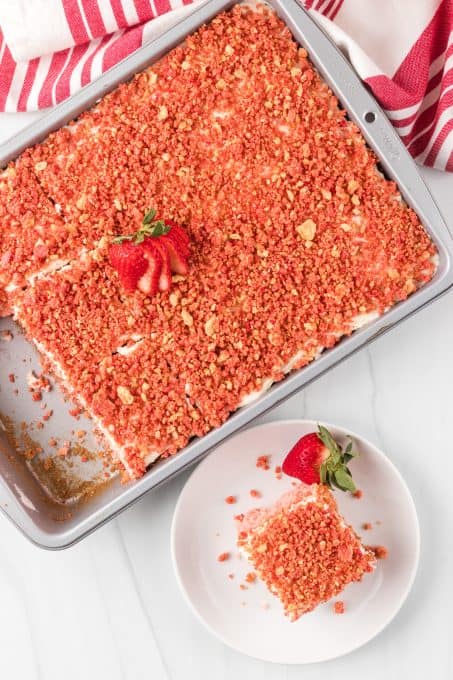 The top of a decorated strawberry cake.