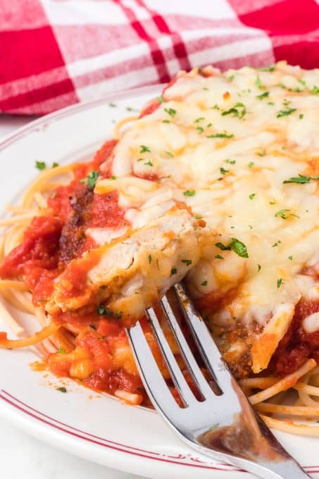 A bite of Parmesan chicken.