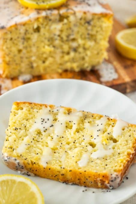 A plated slice of glazed poppy seed bread.