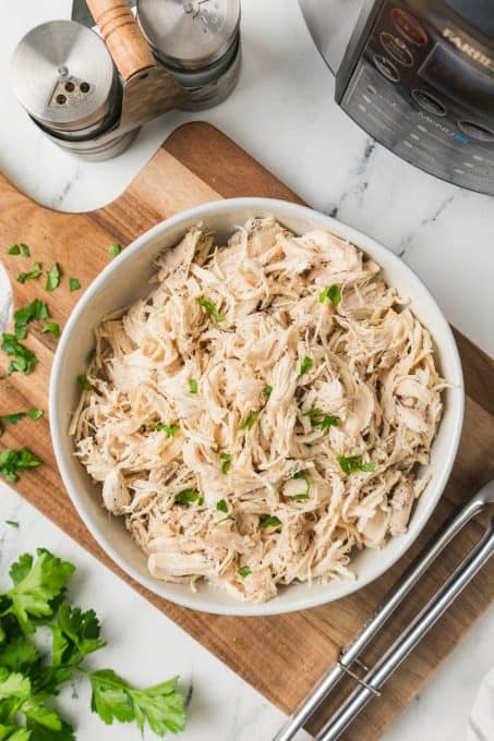 Cooked shredded chicken perfect for using in any recipe! Cooking it this way makes it so quick and easy.