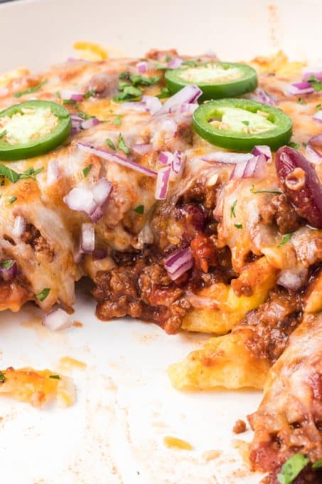 Homemade chili tops really cheesy French fries.