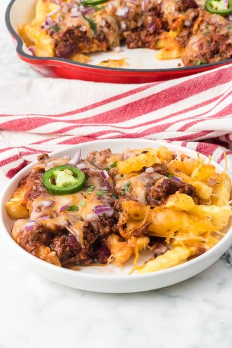 Homemade chili on top of cheesy French fries.