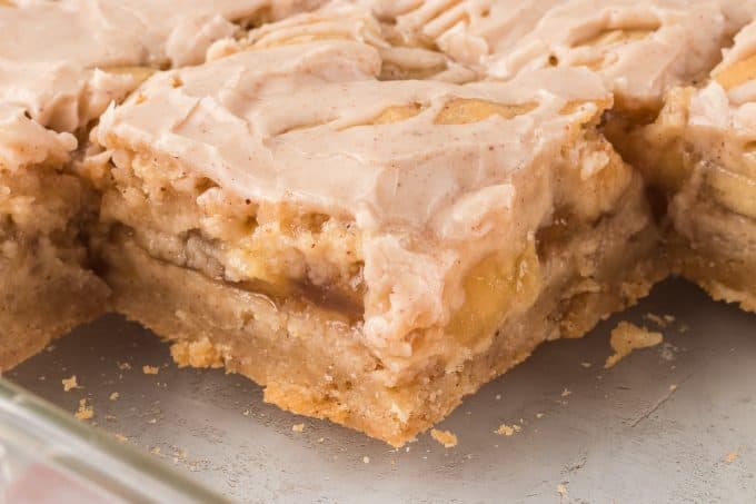 Pie bars with a spiced shortbread crust and apple pie filling.