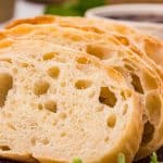 Slices of Ciabatta on a cutting board.