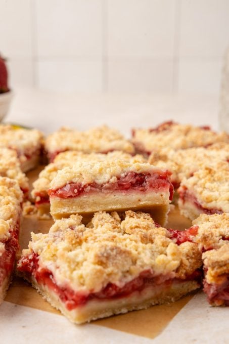 A bite taken out of Strawberry Crumble Bars.