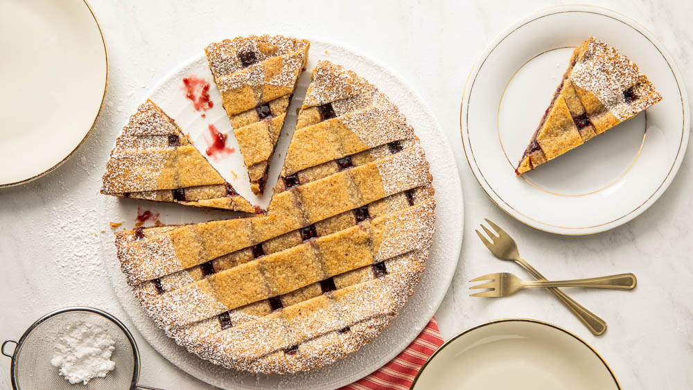 Linzer torte overhead angle on marble surface.