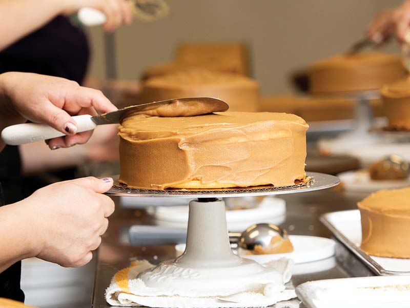 Caramel Cake Being Iced