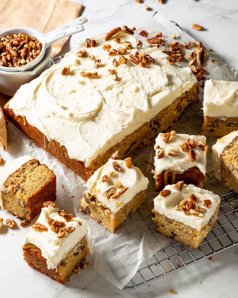 Butter Pecan Poke Cake sliced on wire rack