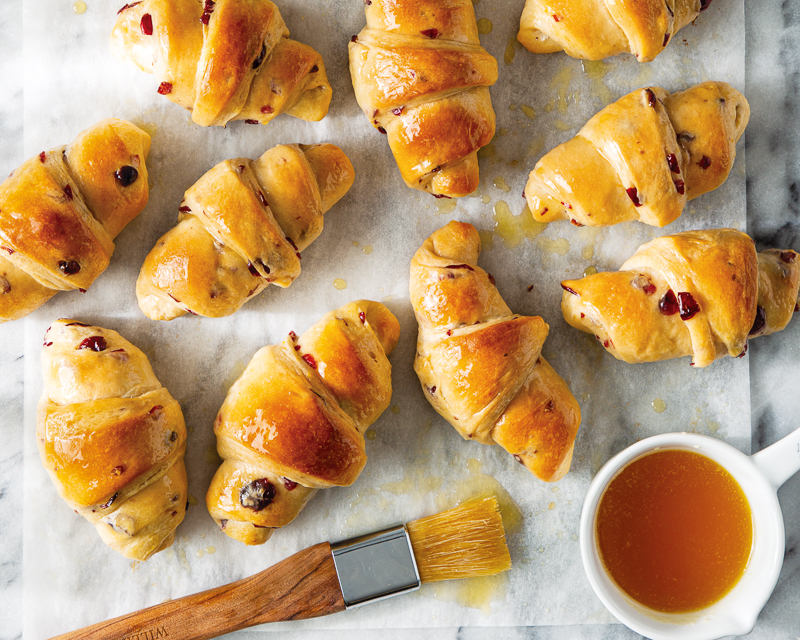 cranberry-orange crescent rolls on parchment