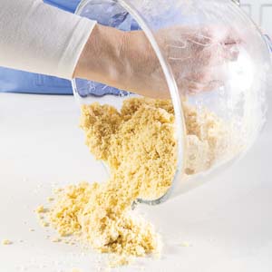 putting dough on counter