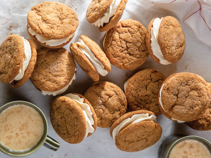Eggnog-Molasses Sandwich coookies stacked on each other photographed overhead.