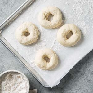 Bagel Dough Resting on Parchment Paper