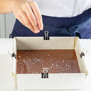 Putting salt on caramel candies