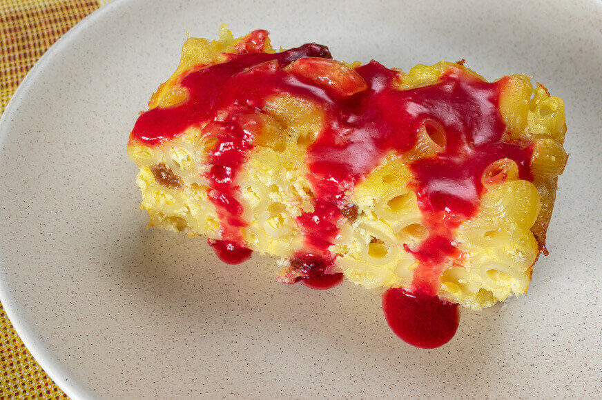 Baked macaroni pudding with a raspberry topping.