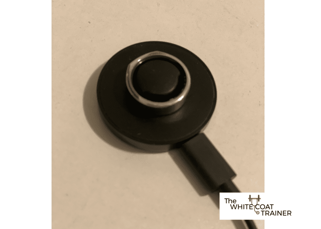 oura ring sitting on the charger