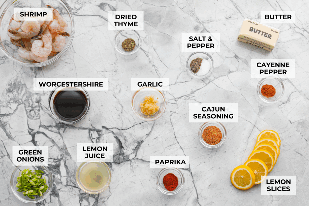 Overhead shot of labeled New Orleans BBQ shrimp ingredients. 