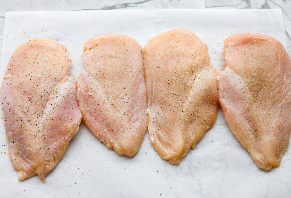 Chicken pounded and seasoned with salt and pepper. 