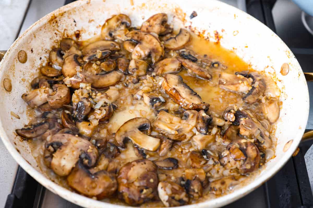 Brandy or cognac  added to the mushroom mixture. 