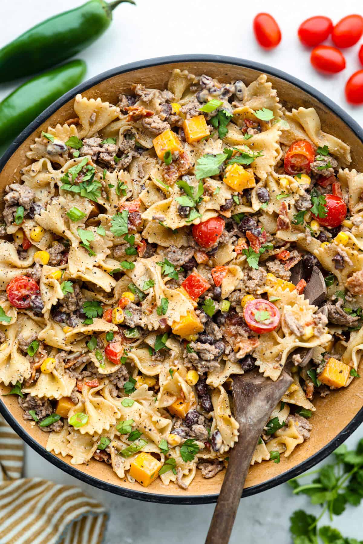 Overhead shot of cowboy pasta salad in a serving dish. 