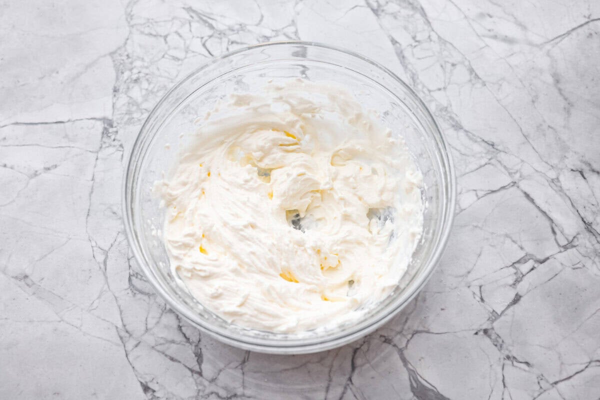 Whipping cream whipped to stiff peaks.