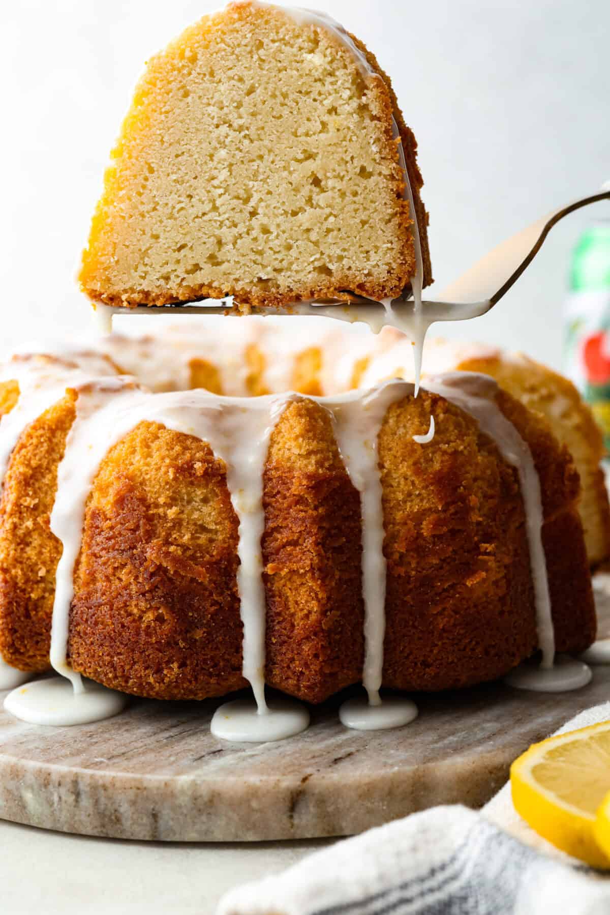 Slice of 7UP bundt cake being lifted out of the cake on a spatula. 