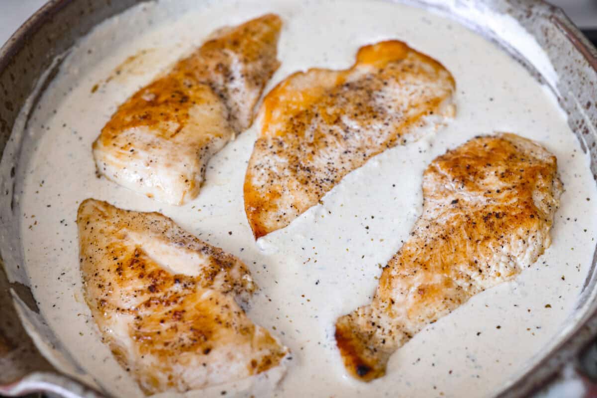 Cooked chicken added to the sauce. 