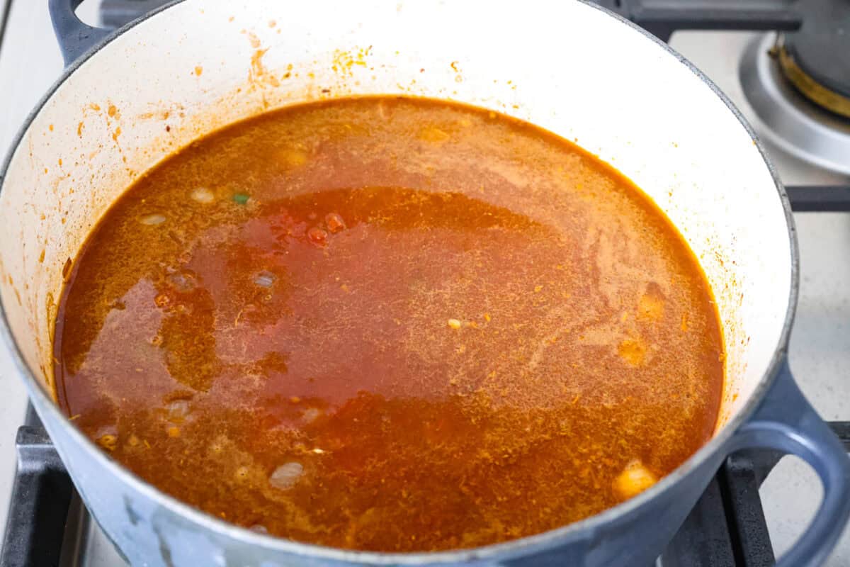 Beef broth added to the onion and seasoning mixture. 