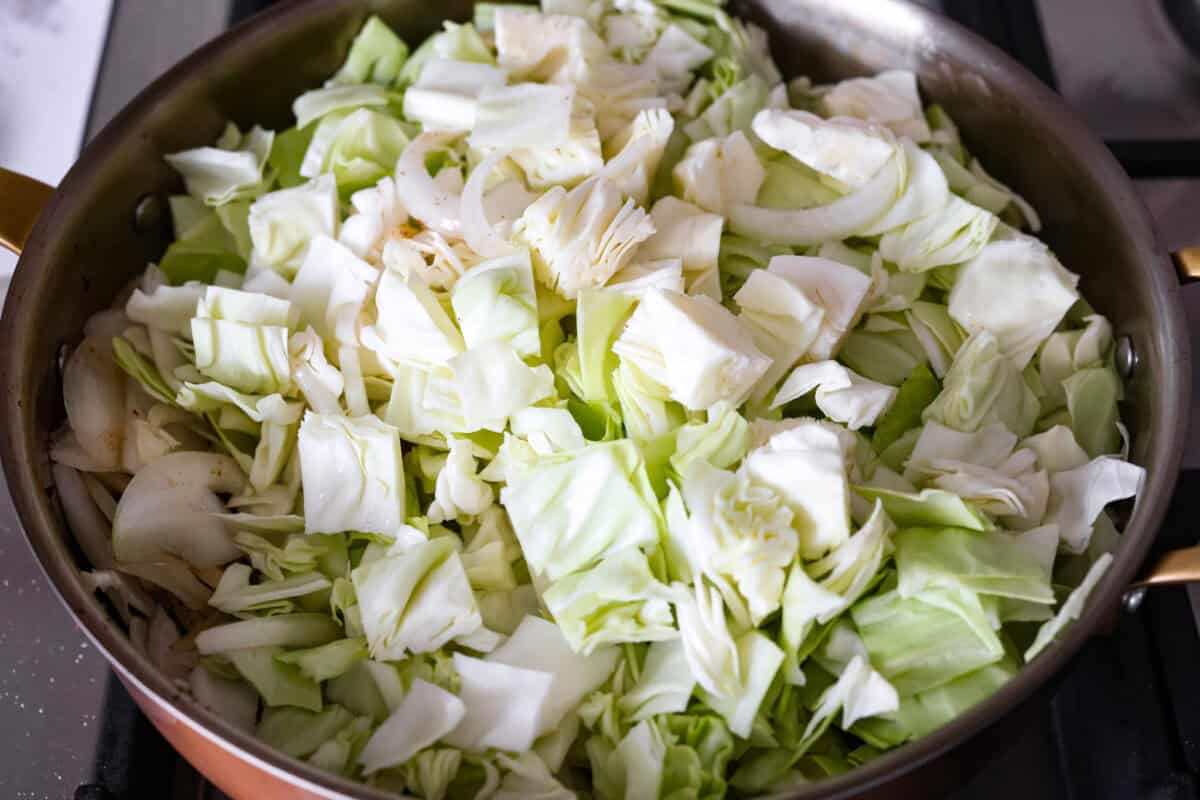 Cut up cabbage in a skillet.