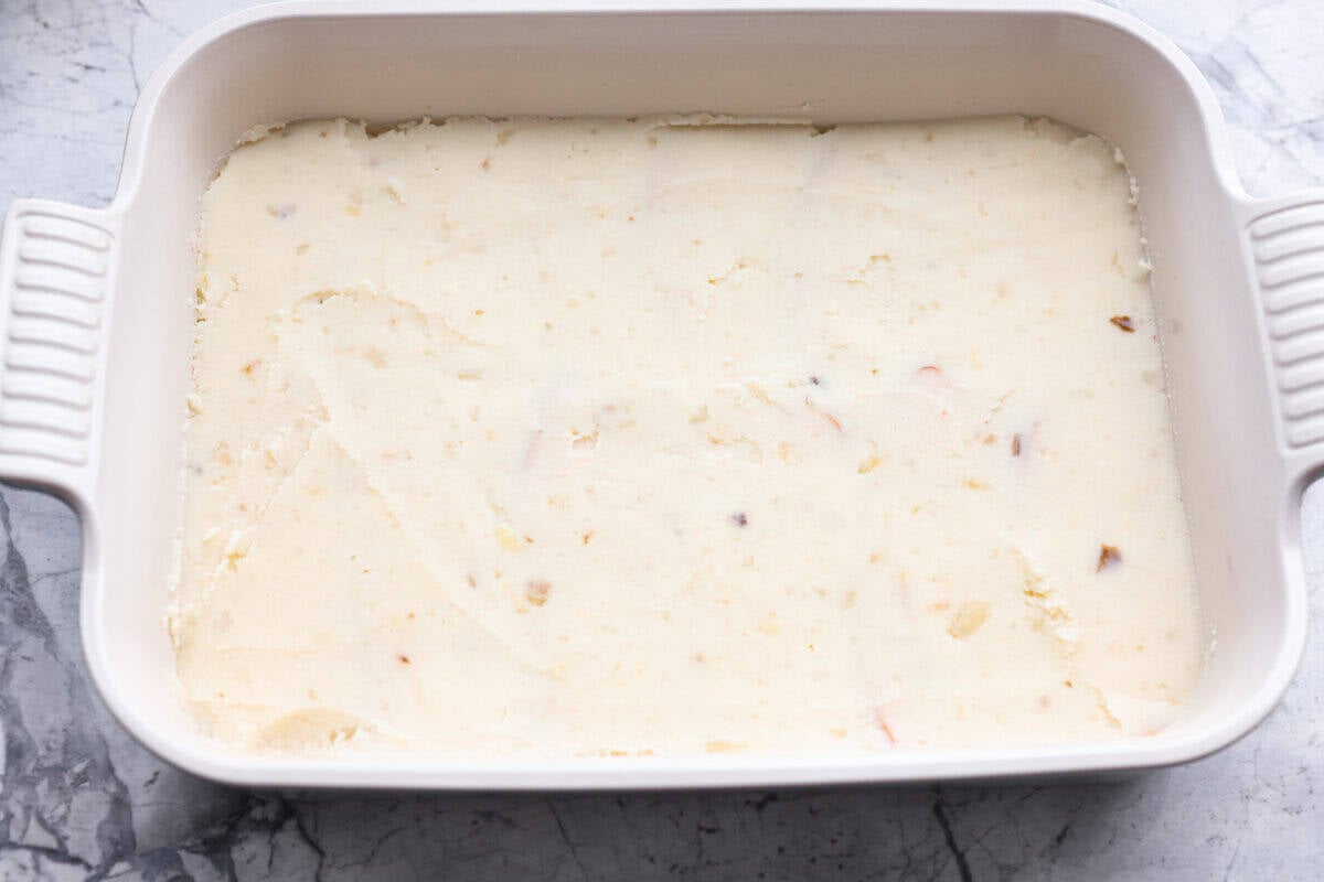 Mashed potatoes layered over the top of the turkey. 