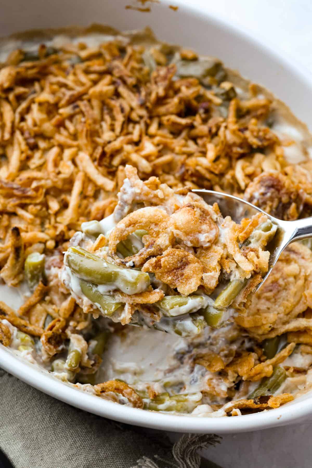 Close up of a scoop of 5 ingredient green bean casserole. 