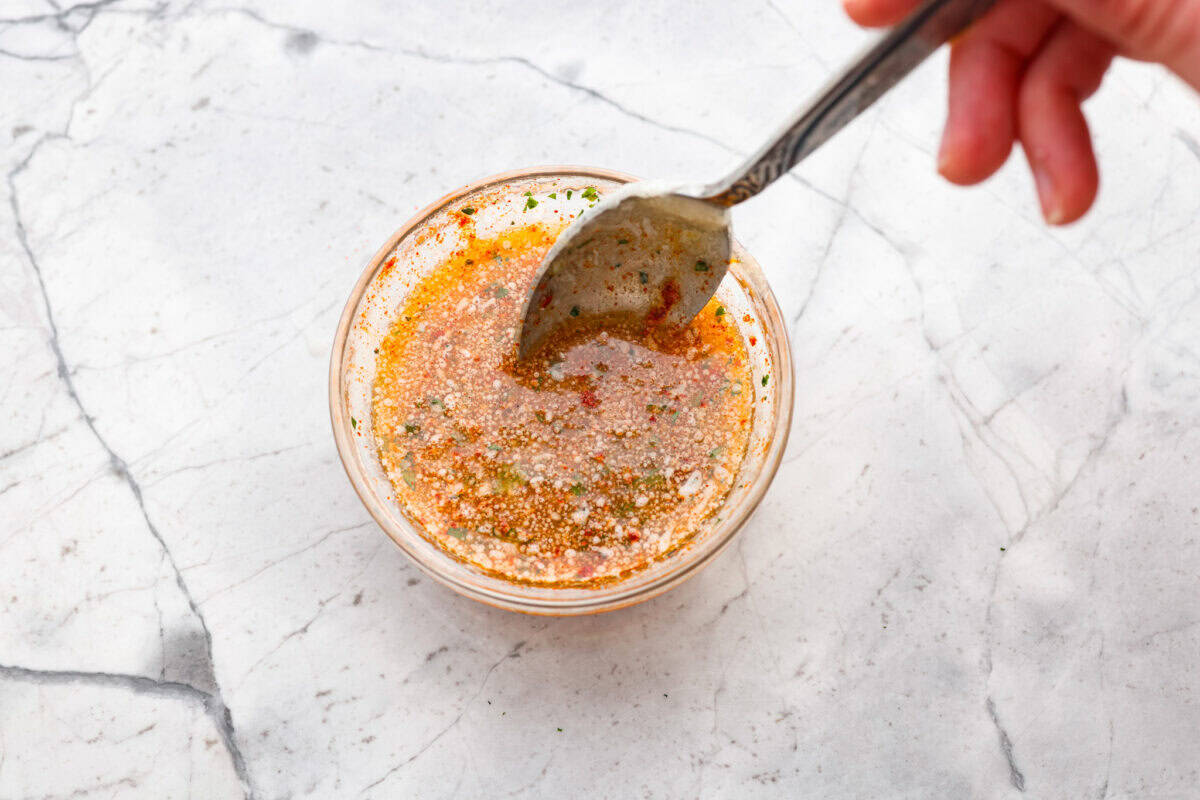 Melted butter mixed with all of the herbs and spices. 