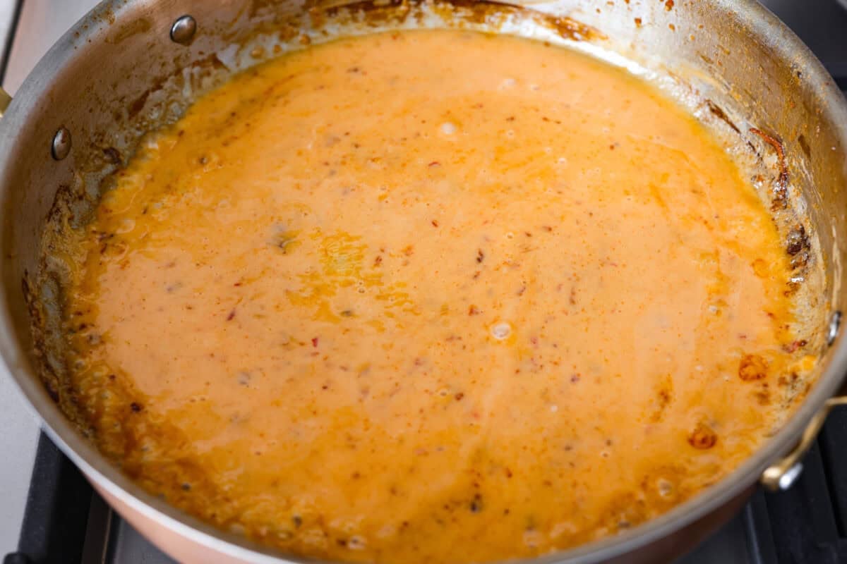 Sauce cooking in a skillet.
