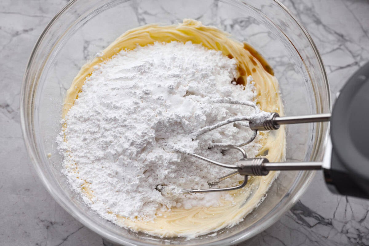 Powdered sugar and flavor extracts added to the chocolate and butter mixture. 