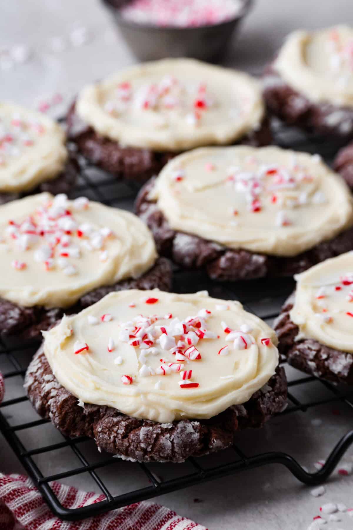 Angle shot of chocolate peppermint cookies on a cooling rack. 