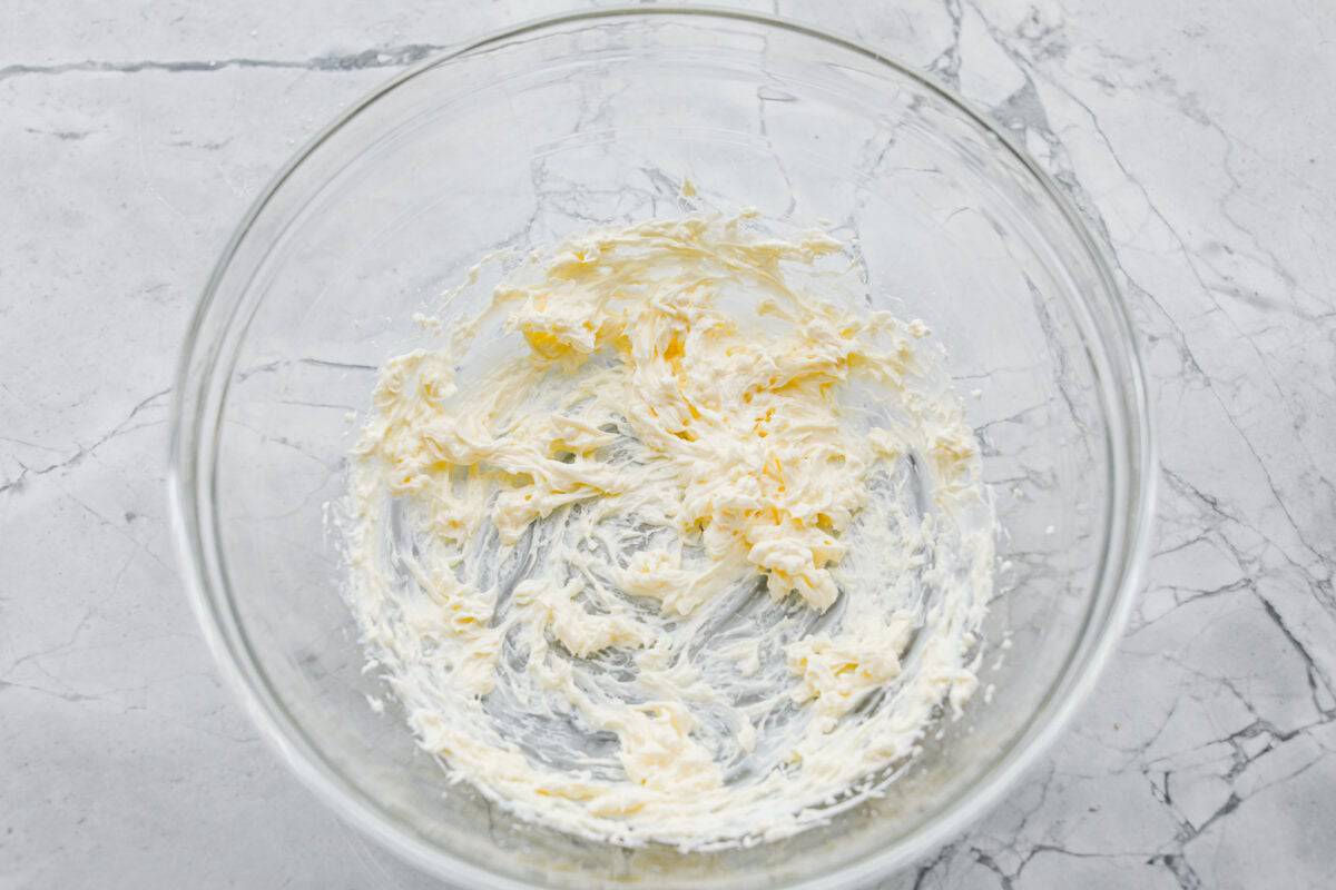 Cream cheese mixed in a bowl for the icing. 