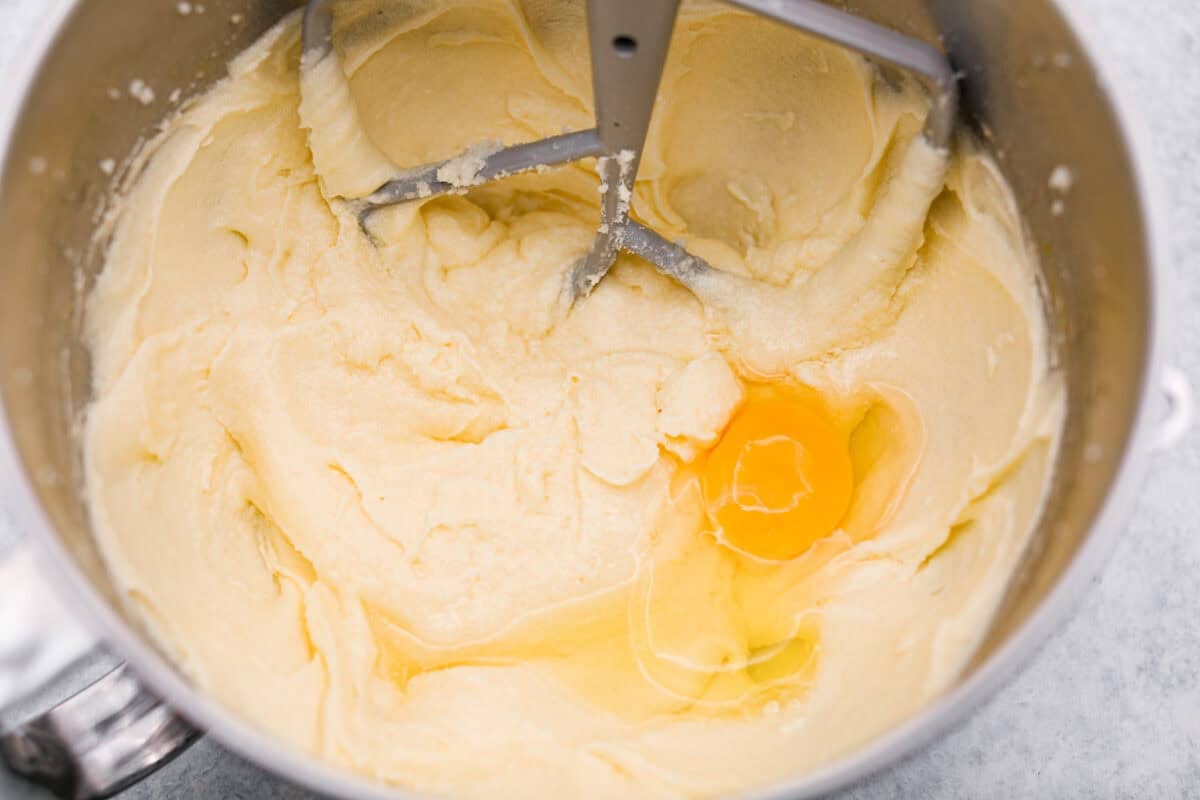 Eggs being added in to the stand mixer one at a time. 