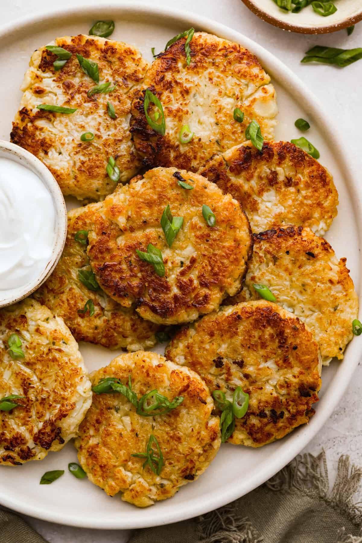 Plate of fried crispy cauliflower fritters. 