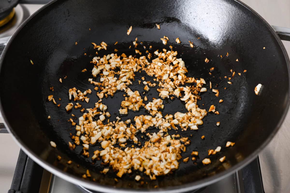 Angle shot of fried garlic, slightly brown. 